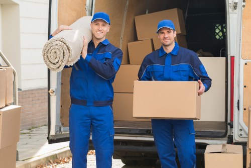 Man with van removal service loading furniture in Hydepark