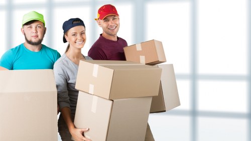Student and household items prepared for collection by a man and van service in Hydepark