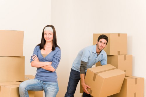 Local furniture pick-up process showing loading of sofas and tables