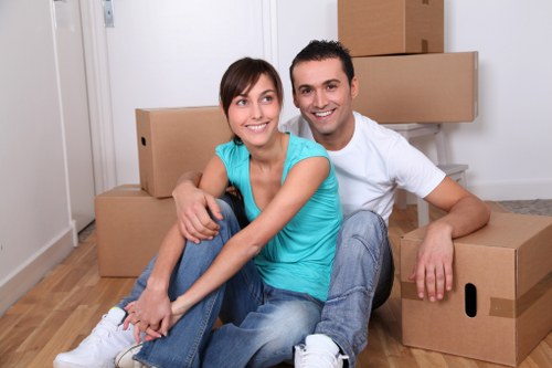 Team member wearing PPE while handling furniture for a safe relocation