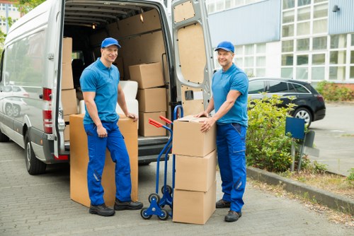 Furniture and boxes being loaded into a moving van for a Hydepark job