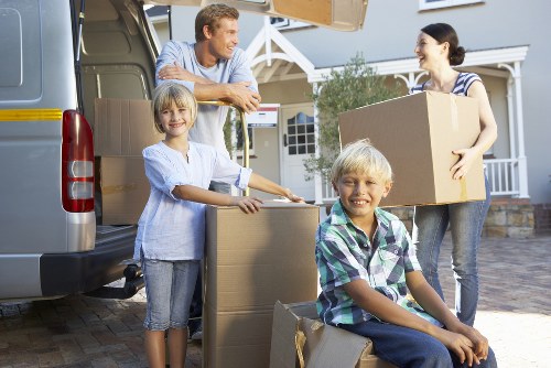 Packed moving boxes and furniture ready for transport in Hydepark